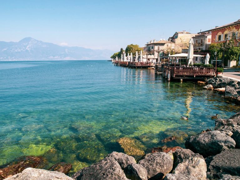 Clear Sea Water in Beach With Cottages