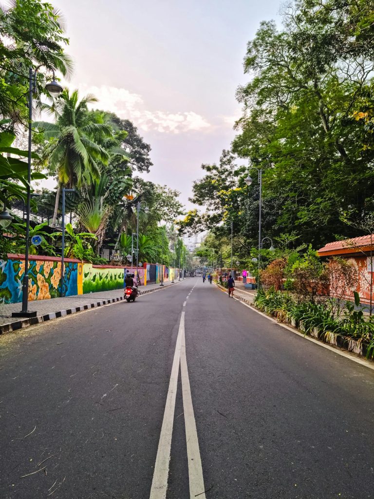 A clean city street or park with a few relaxed pedestrians