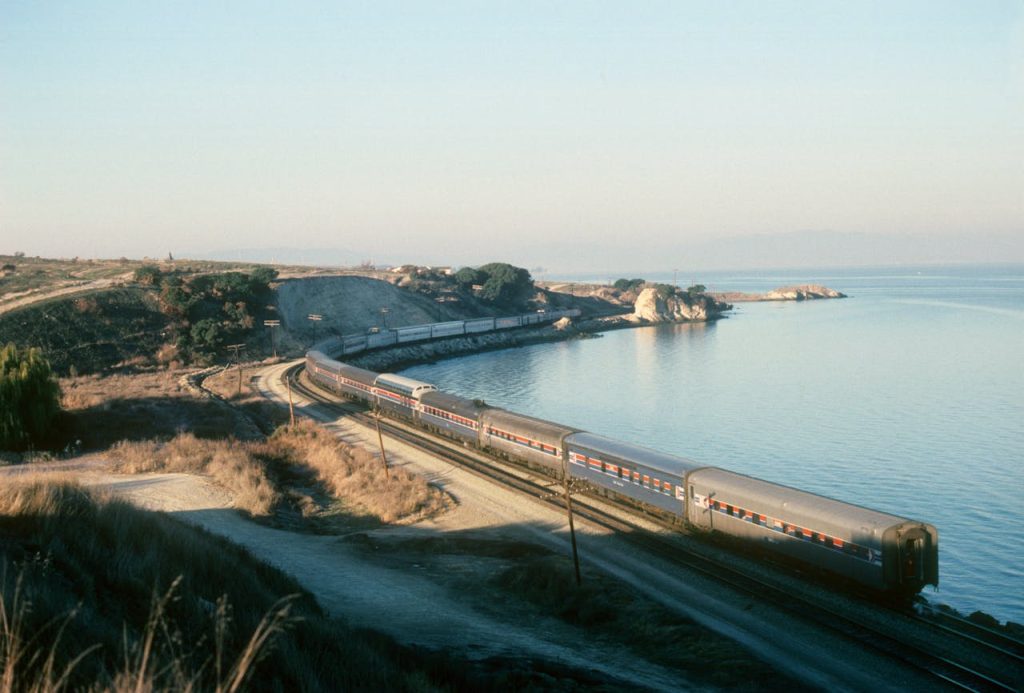 Sunset Train on Western Coastline
