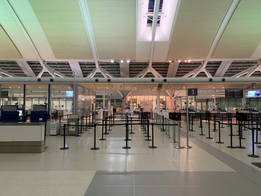 A nearly empty airport terminal during a calm hour.