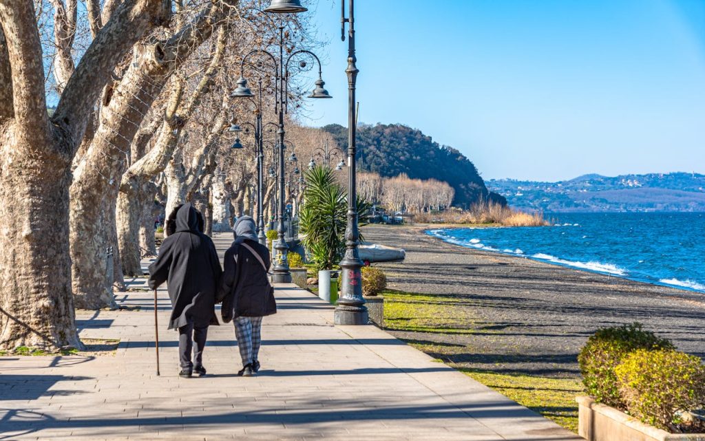 A person walking through a park, exploring a historic neighborhood,