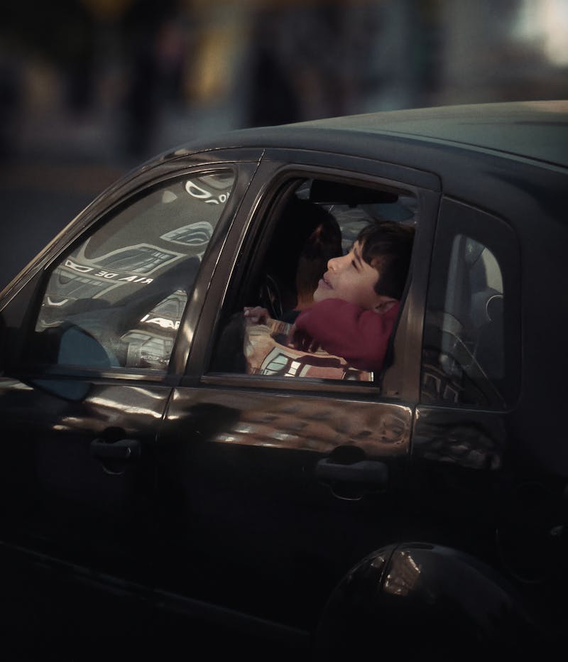 Person inside a Car looking Up in the Sky