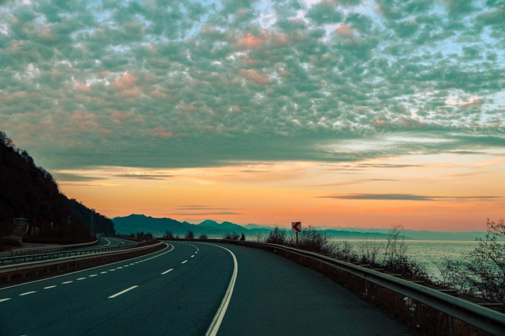 Empty Asphalt Road on the Coast at Sunset 