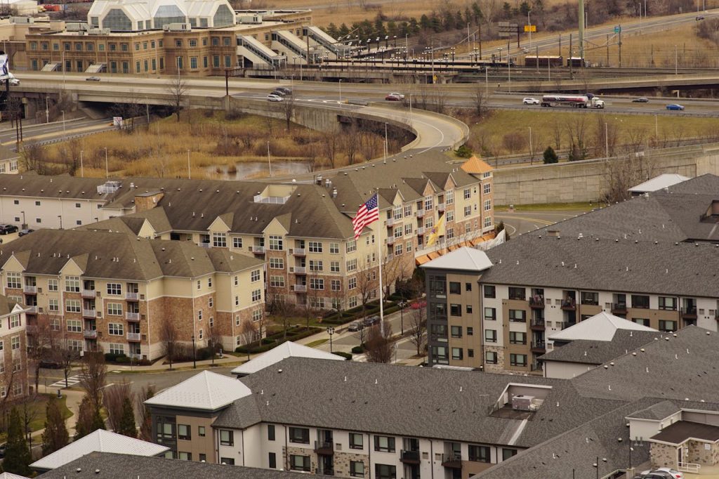 American Flag Among Apartment Buildings

