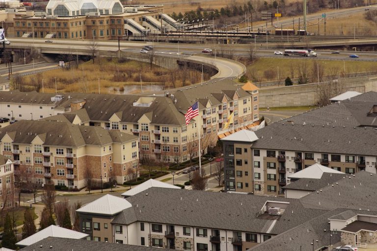 American Flag Among Apartment Buildings