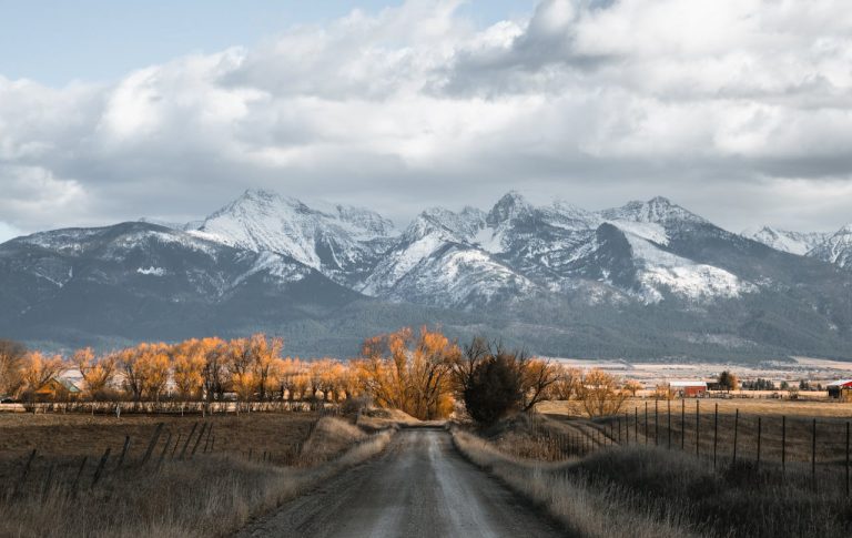 Landscape of Road Against Mountains
