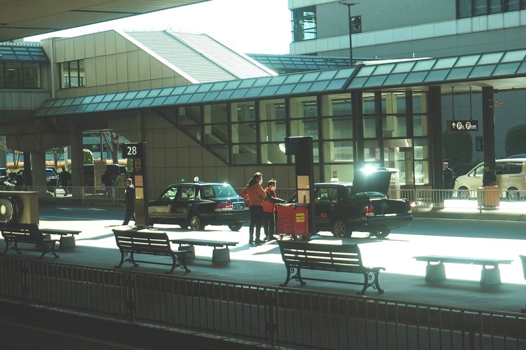 A small regional airport entrance with light foot traffic