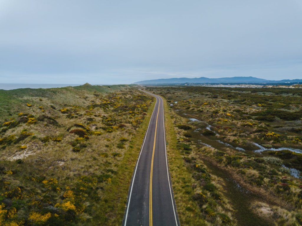 Gray Asphalt Road Across the Valley 