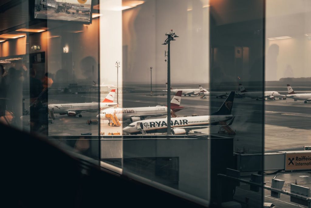 Airplanes at the Airport Seen through Window