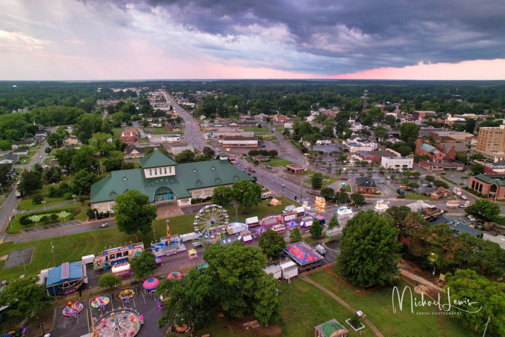 Aerial View of a Lively Town Fair at Dusk