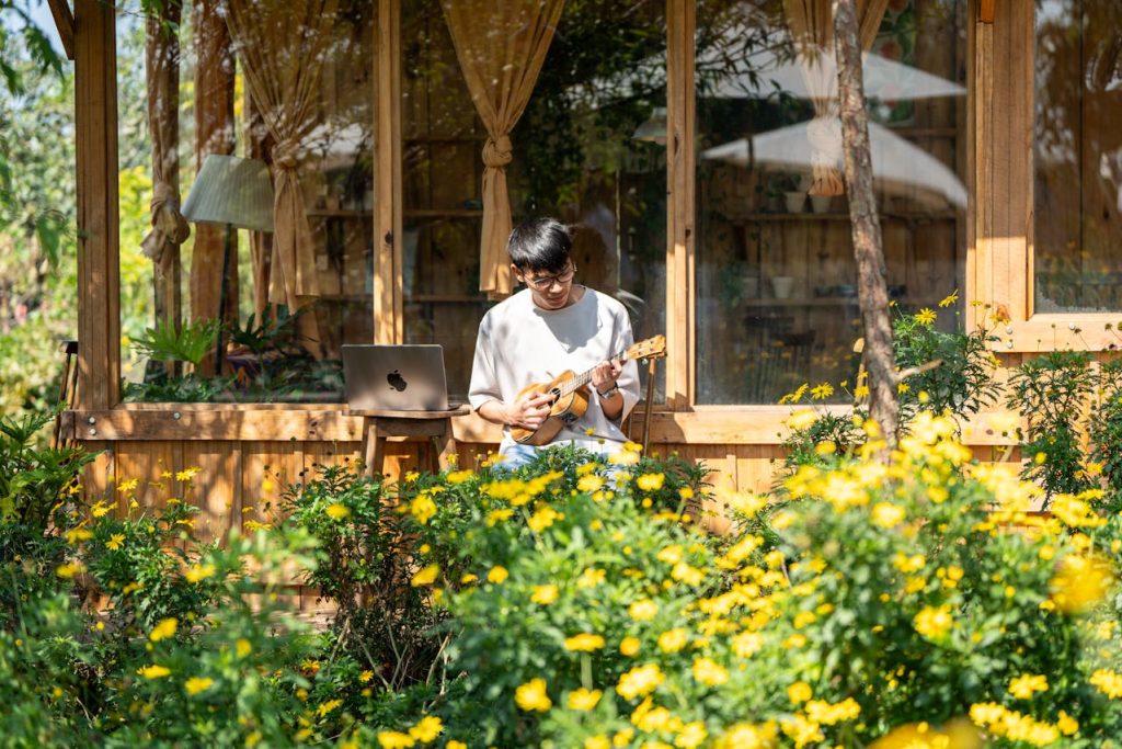 Locals playing acoustic instruments on a porch