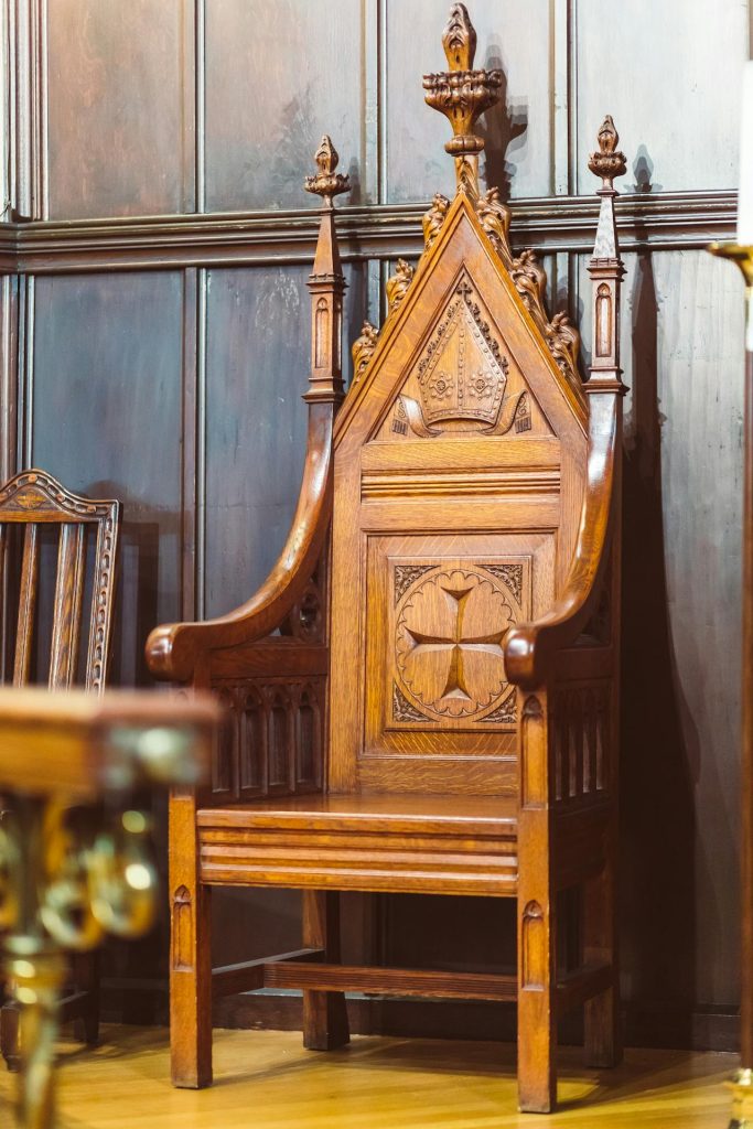 Close-up of handcrafted pews or carved wood details