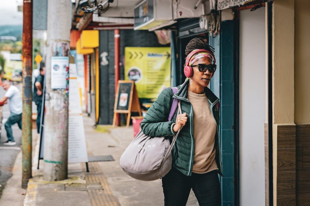 A solo traveler walking through a local street market