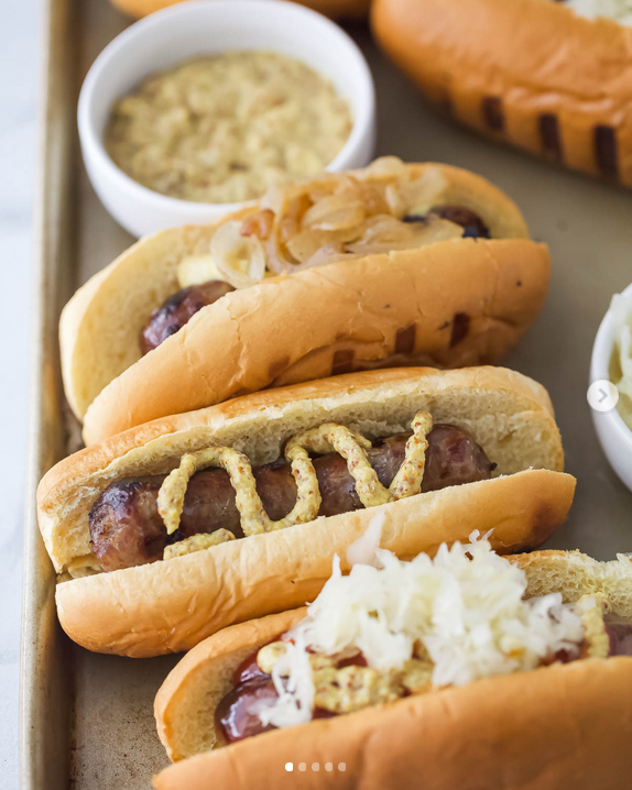 Lager-infused Wisconsin beer brats on soft, toasted buns will be your new summer cookout go-to.