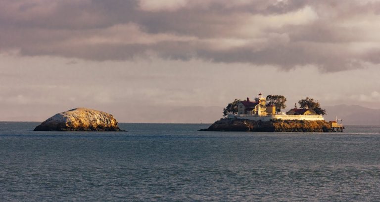 Concrete Building on Island Surrounded by Water