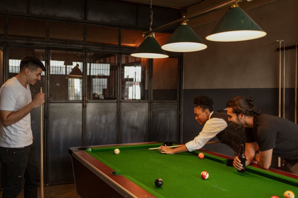 People Playing Pool in a Bar
