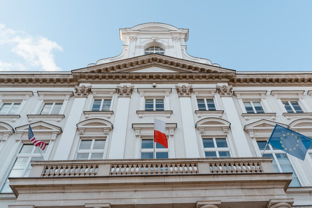 Old Building With Flags Hanging On Balcony