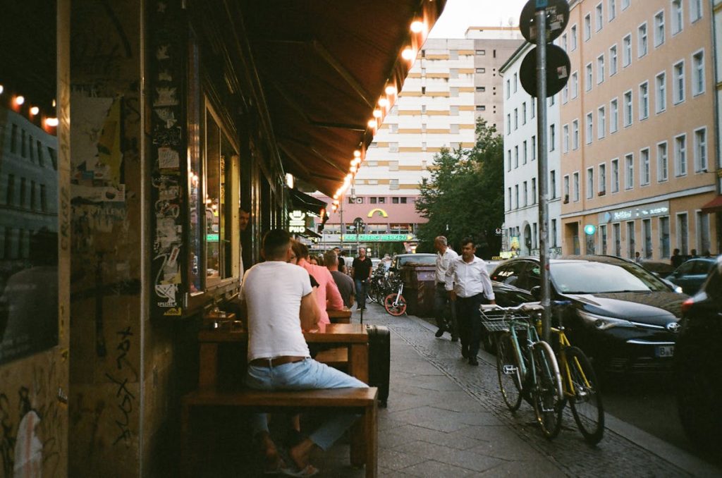 Sitting Man Wearing White Shirt