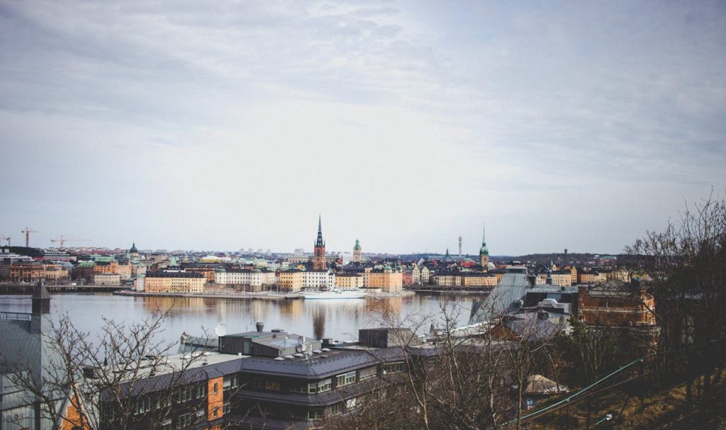 Photo Of Buildings Near Body Of Water