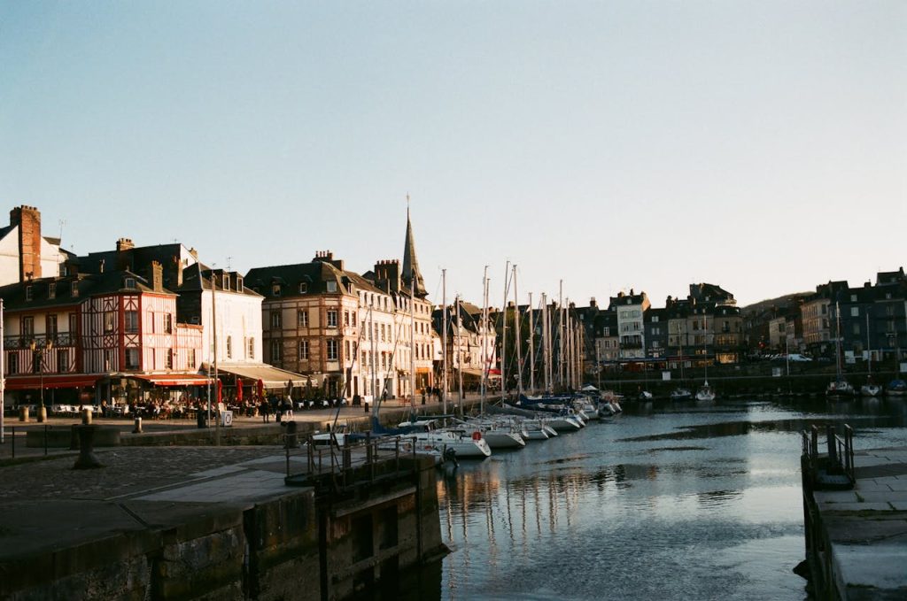 Yachts moored on water near buildings
