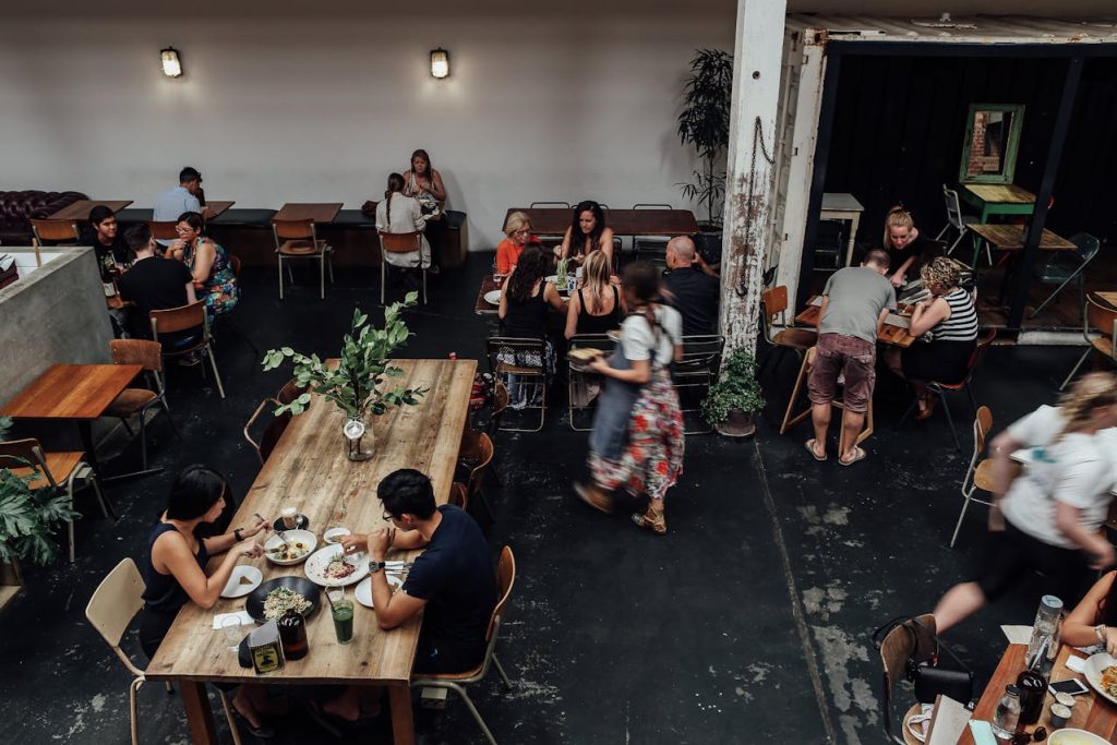 People Sitting on Chairs at a Restaurant