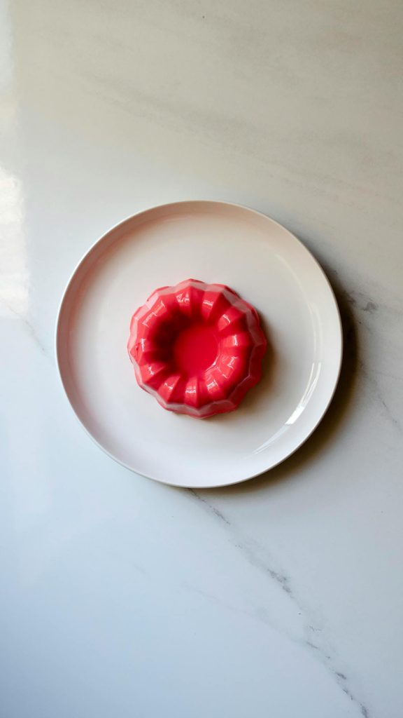 Top View of a Red Cake on a White Plate