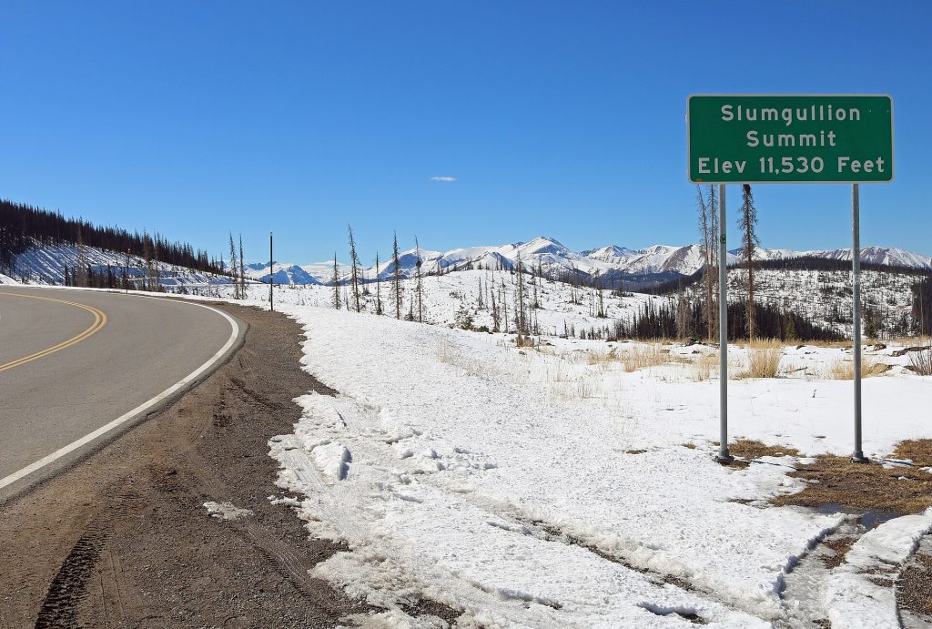 A sign at the top of Slumgullion Pass on Colorado State Highway 149 in Hinsdale County, Colorado.