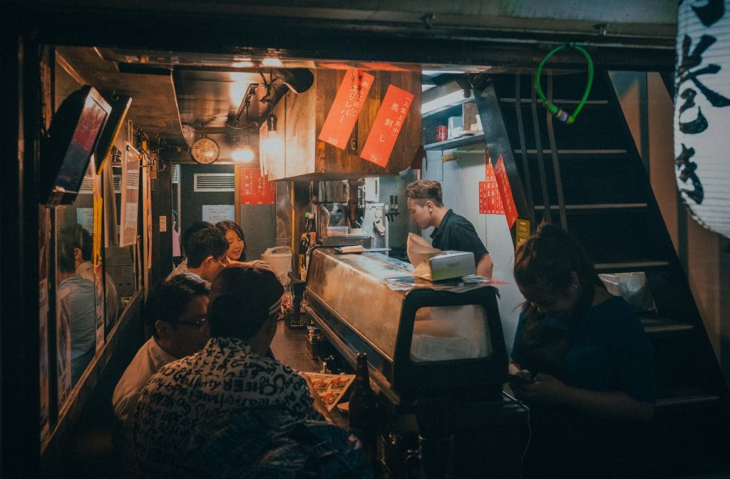 Crowded Seating And Shared Condiments