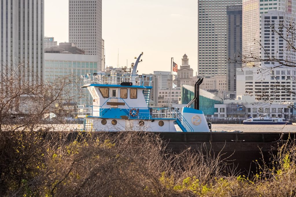 Tugboat on Mississippi River with New Orleans Skyline