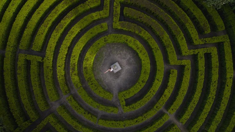 Woman Standing in Middle of Labyrinth