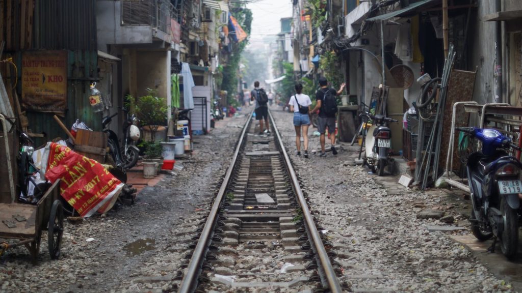 Bustling Street Life along Hanoi Train Tracks
