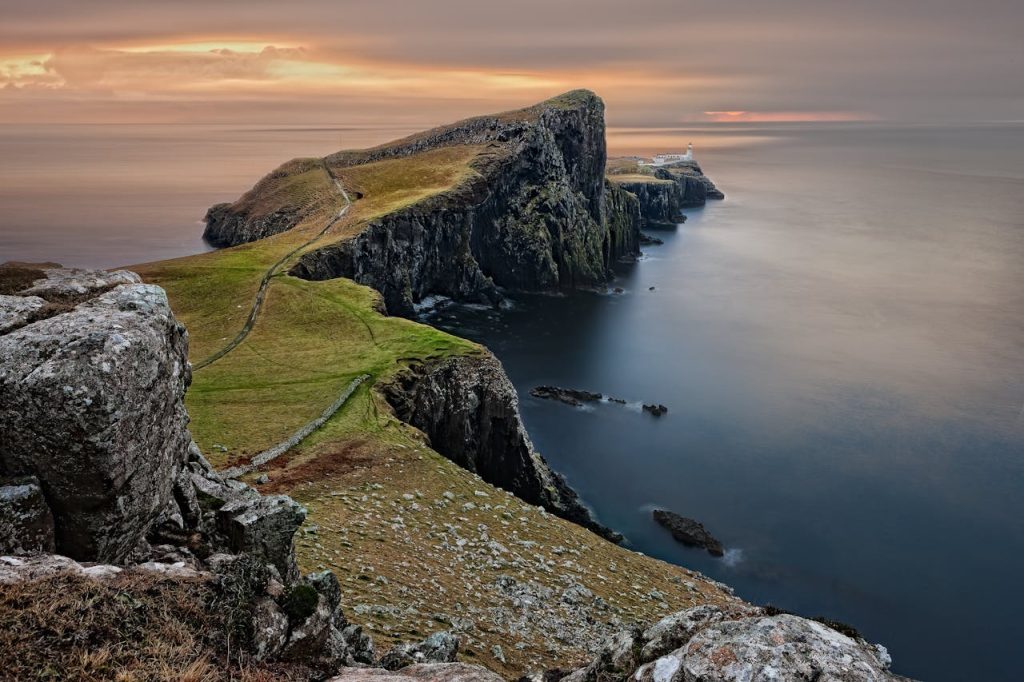 Green and Brown Mountain Cliffs Near Ocean, United Kingdom