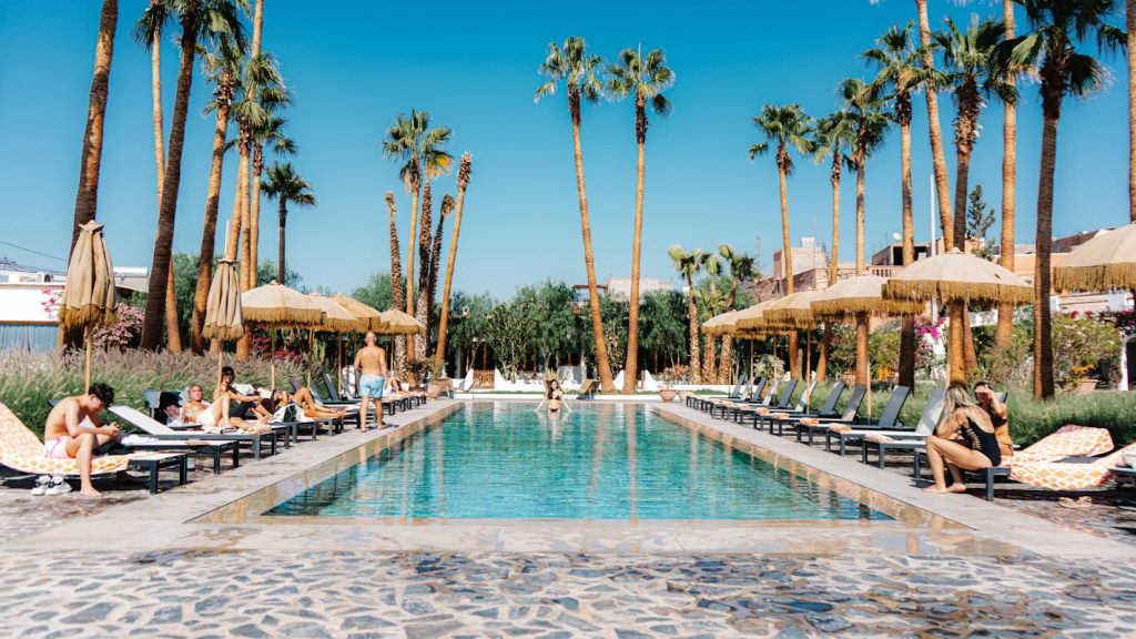 Relaxing Poolside at Palm-Lined Resort