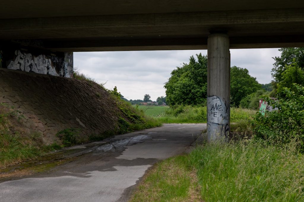 14 Moped Mazes Narrow With Near-Miss Mirrors – Her Life Adventures Urban Underpass in Lush Green Summer Setting