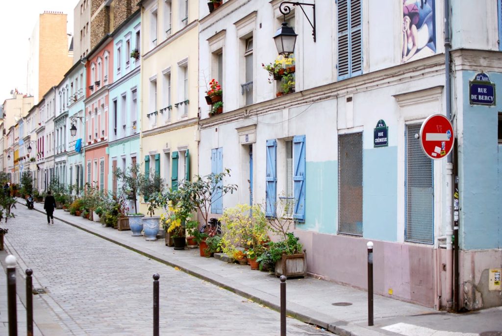 Pastel colors of Concrete Buildings with Windows Near the Street 
