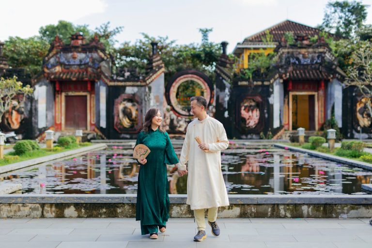 Couple Strolling in Traditional Outfits in ?à N?ng