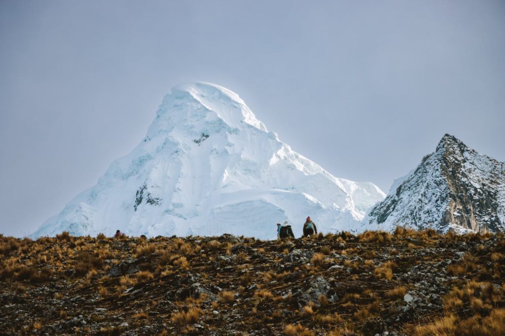 People Hiking in Mountains in Winter