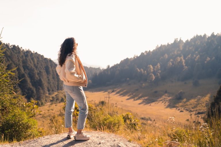 Woman Enjoying Scenic Mountain Valley View