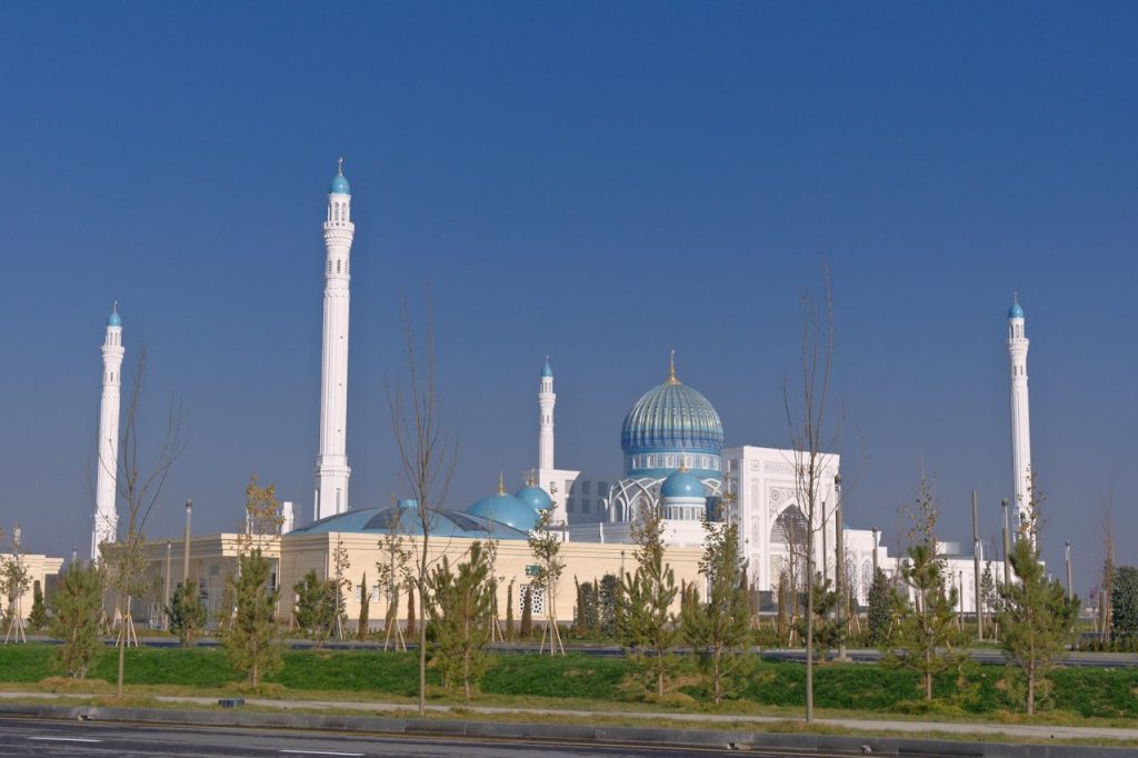 Stunning Mosque with Blue Domes under Clear Sky in Turkmenistan
